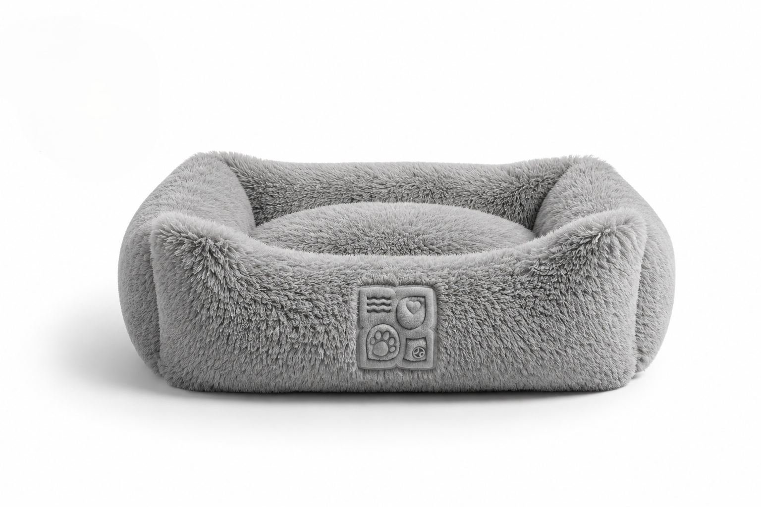 A gray, plush pet bed with a cushioned interior and embossed logo on the front